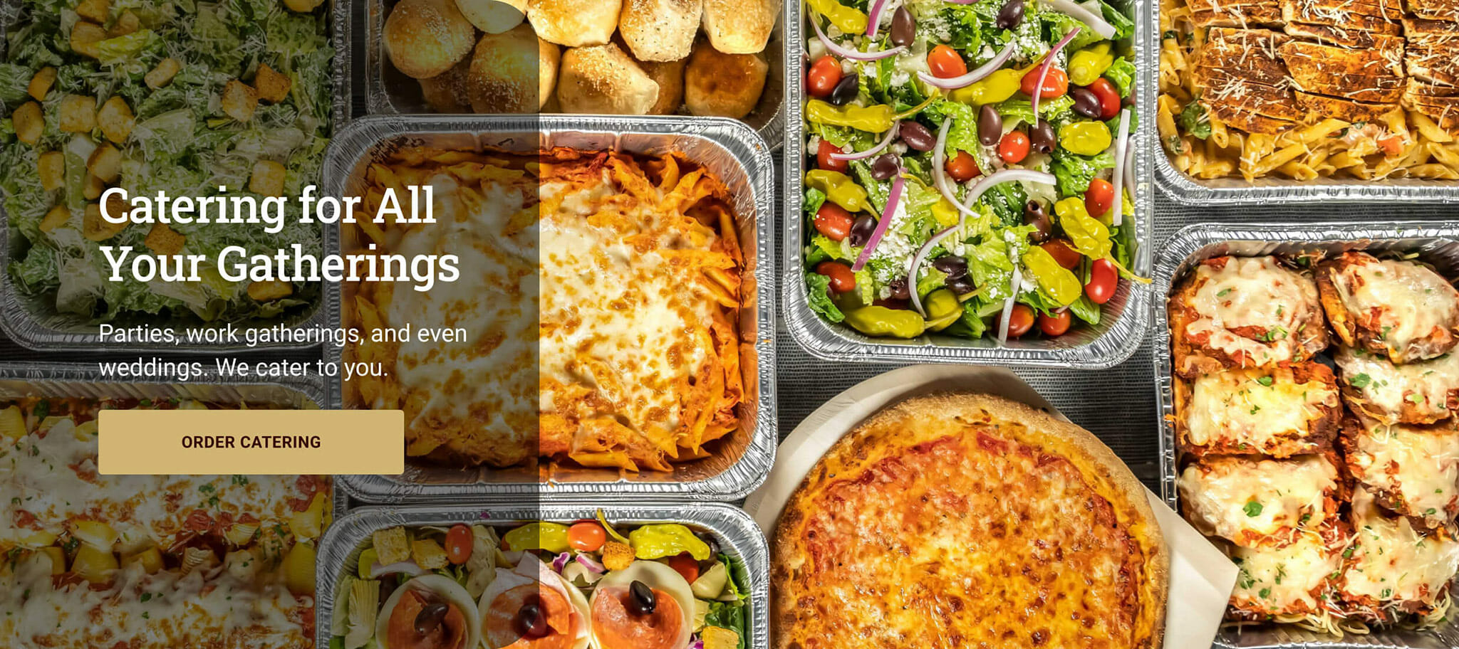 A group of multiple food items showing pasta, salad, pizza, and chicken parmesan in silver catering trays sitting on a table