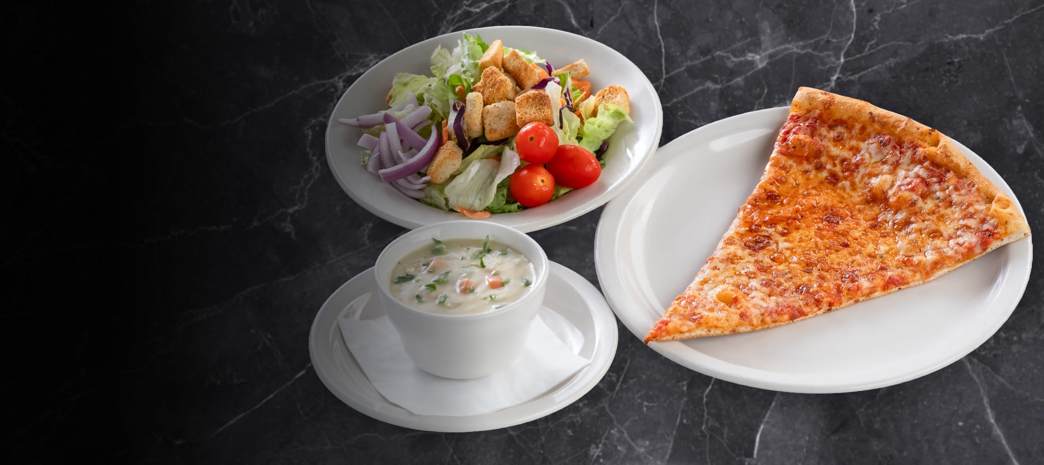 Bowl of salad, cup of soup and slice of cheese pizza Bowl of salad, cup of soup and slice of cheese pizza